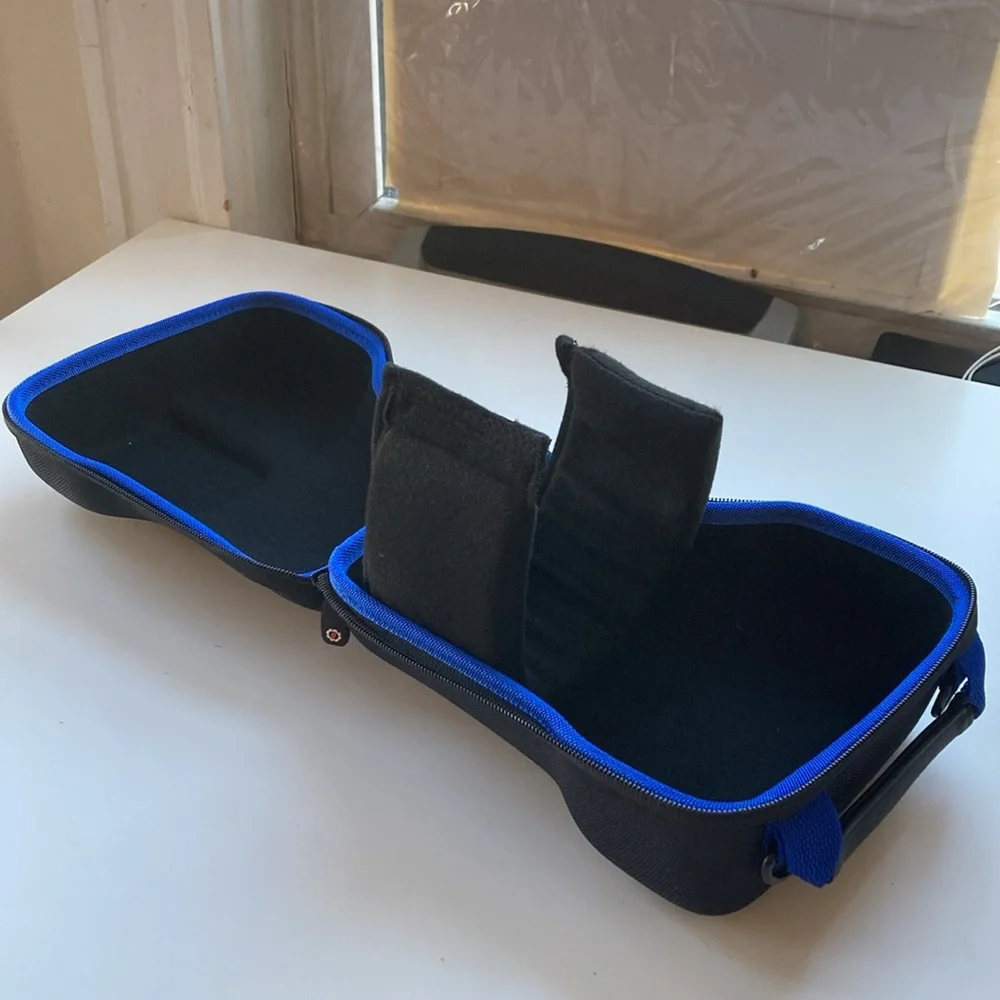 Hard carrying case for long-lens camera with strap
